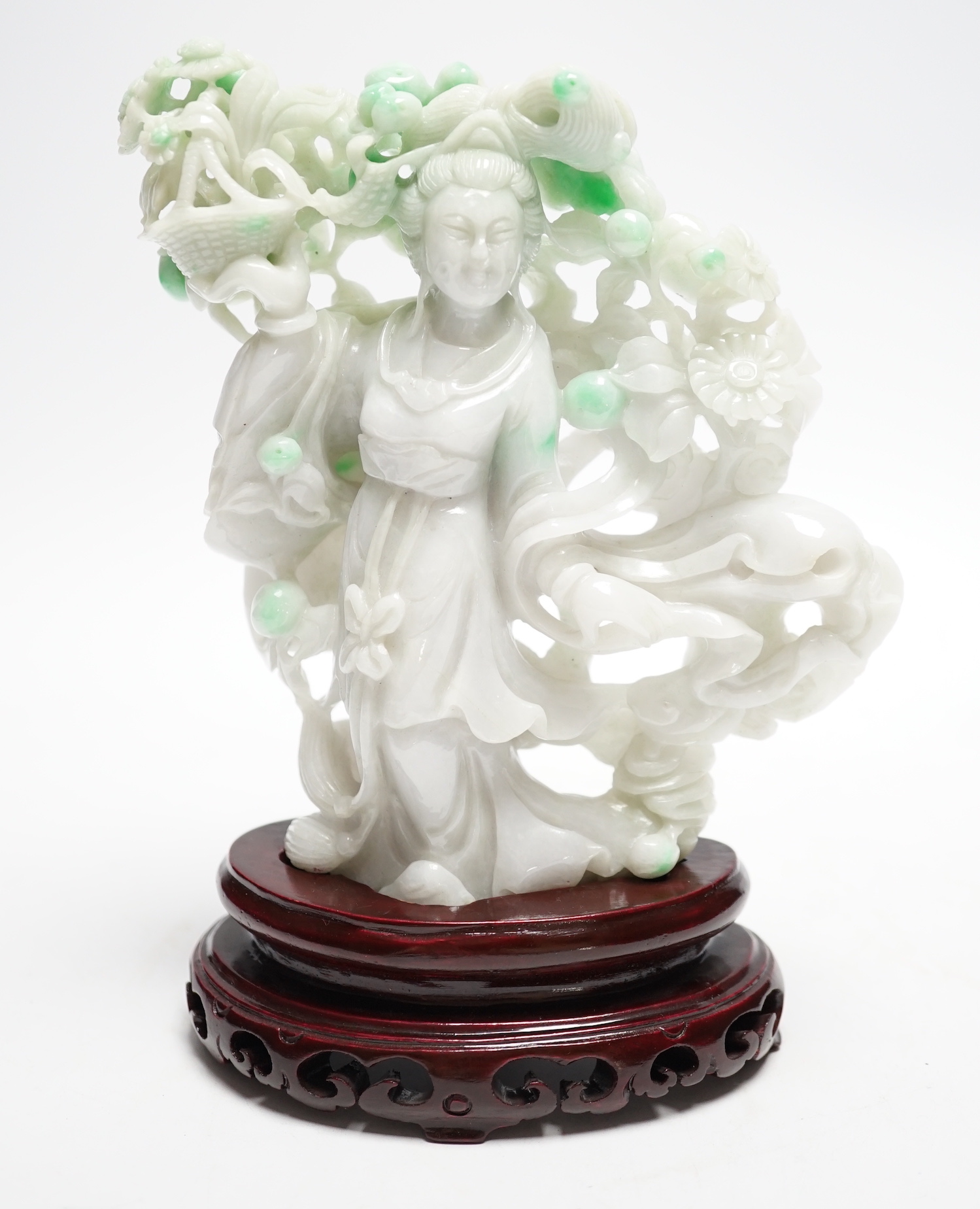 A Chinese jadeite figure of He Xiangu on carved stand, 17cm high